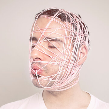 Man eating wool yarn