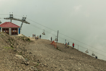 Fototapeta na wymiar Sochi, Russia-July 11, 2020: ropeway in the Caucasus mountains in Rosa Khutor