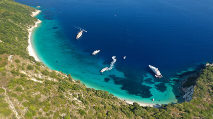 Aerial drone photo of beautiful paradise steep cliff sandy beach of Gidaki accessible by short hiking in beautiful Ionian island of Ithaki or Ithaca, Greece
