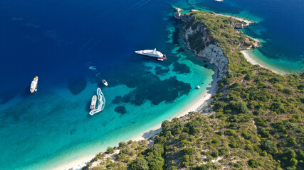 Aerial drone photo of beautiful paradise steep cliff sandy beach of Gidaki accessible by short hiking in beautiful Ionian island of Ithaki or Ithaca, Greece