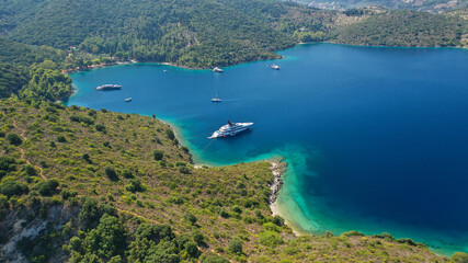 Fototapeta na wymiar Aerial drone photo of beautiful paradise peninsula and bay of Skinos with many crystal clear beaches in beautiful Ionian island of Ithaki or Ithaca, Greece