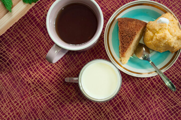 cups with milk, compote, coffee, flat lay