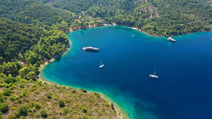 Fototapeta na wymiar Aerial drone photo of beautiful paradise peninsula and bay of Skinos with many crystal clear beaches in beautiful Ionian island of Ithaki or Ithaca, Greece