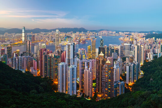 China, Hong Kong, Victoria Peak. View over Hong Kong from Victoria Peak. The illuminated skyline of Central sits below The Peak