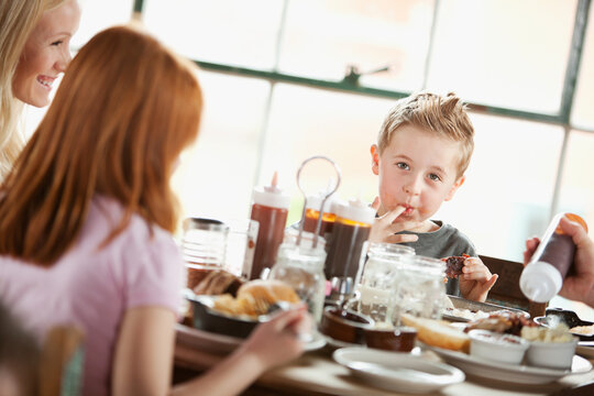 Barbeque: Little Boy Licks Sauce From Fingers