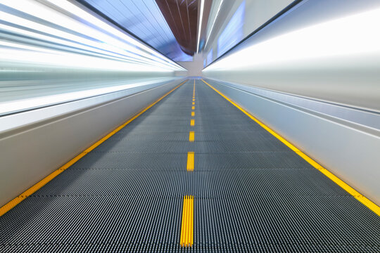 View along a moving walkway in Dubai International Airport, Dubai, United Arab Emirates, UAE