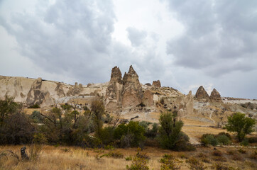 Plakat Beautiful Cappadocia landscape. Unique geological formations with stone rock houses and caves Tourism and travel.
