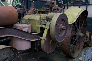 Fototapeta na wymiar antique metal car forming a mechanical background in a museum