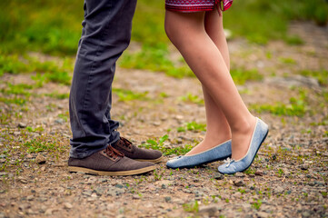 Feet of a loving couple in shoes
