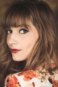 A close up portrait of a beautiful woman with a mole
