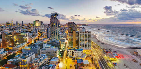 Middle East, Israel, Tel Aviv, elevated dusk view of beachfront hotels and coastline