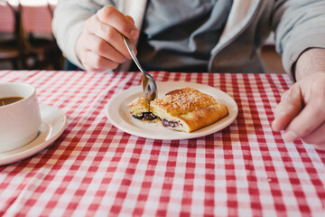 Man eating cake in Denmark