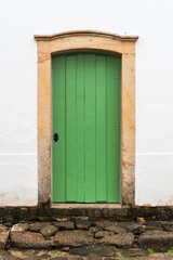 Obraz na płótnie Canvas Green door of colonial house in the historical city of Paraty, in Brazil