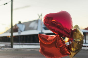 Three shiny mylar baloons