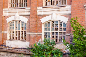Naklejka premium The destroyed building of the former metallurgical plant. Former factory. Devastation.