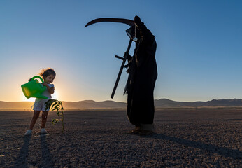 horror grim reaper holding is holding a clock in one hand and a scythe in the other. A green plant...