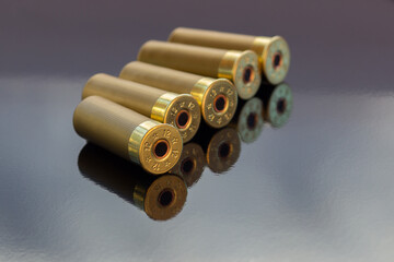Gold cartridges on the black glossy background