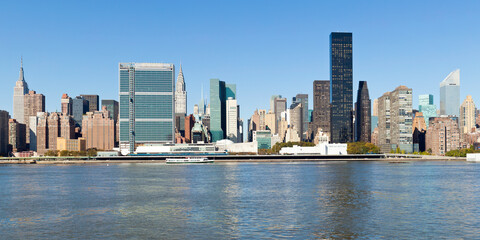 Skyline of Midtown Manhattan seen from the East River showing the Chrysler Building and the United Nations building, New York, United States of America