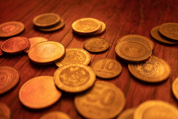 Argentine money of different value on a wooden cabinet. Argentina currency