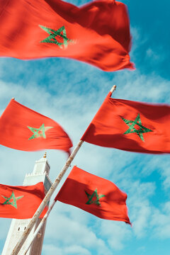 Flags of Morocco waving in the wind and Hassan II Mosque, the third largest mosque in the world, Casablanca, Morocco, North Africa