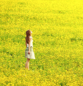 Woman in flower meadow
