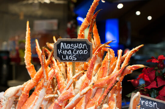 Alaskan king crab legs being sold at an outdoor market