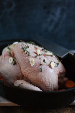 Free range chicken being prepared for roasting.