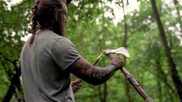 Man sharpening stick