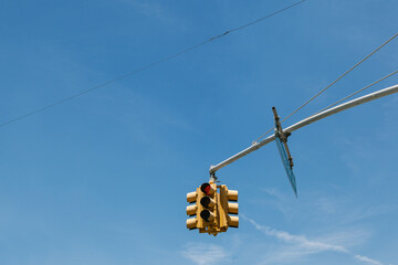 Yellow Traffic Light Against a Blue Sky