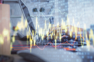 Double exposure of woman hands typing on computer and forex chart hologram drawing. Stock market invest concept.