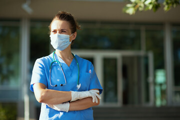 confident modern physician woman outside near hospital