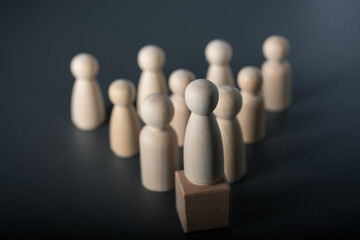 Leadership concept, wooden human figure selective focus