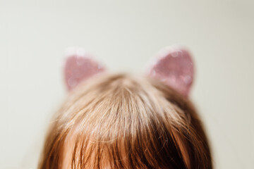 top of head with glittery pink kitty ears headband