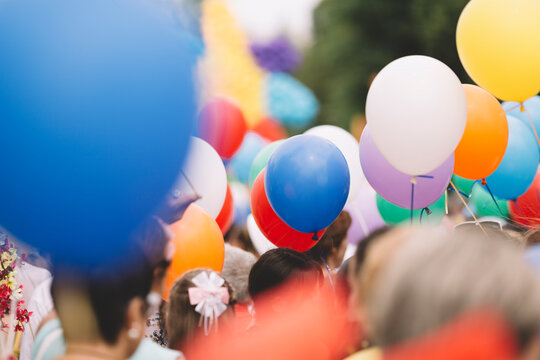 crowd with colorful balloons