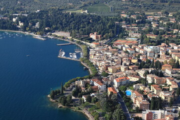 Fototapeta na wymiar Garda View. An aerial view from Rocca across the town of Garda. Garda is a town on the edge of Lake Garda in North East Italy and Rocca is a large hill overlooking the town.