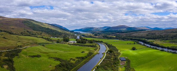 aerial drone footage of summer in gairlochy near fort william on the caledonian canal in the argyll region of the highlands of scotland showing the mountains of glencoe and the surrounding region © Andy Morehouse