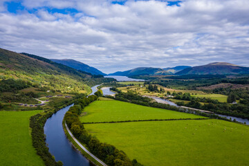 Fototapeta na wymiar aerial drone footage of summer in gairlochy near fort william on the caledonian canal in the argyll region of the highlands of scotland showing the mountains of glencoe and the surrounding region