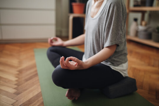 Woman Meditating in the Lotus Pose.