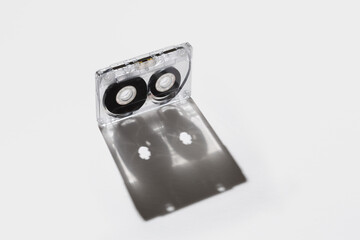 Cassette tape made of clear plastic on white background