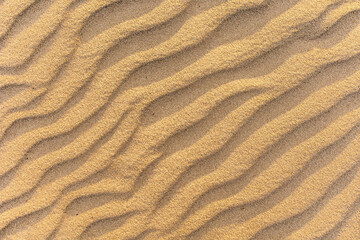 Fototapeta na wymiar .Wavy sea sand background