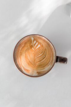 flat white cafe latte overhead with shadow