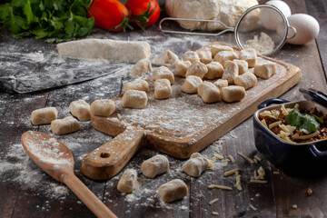 gnocchi on a table decorated with ingredients