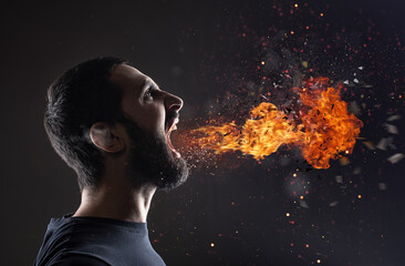 Stressed man screams with fire and smoke that exit from the mouth