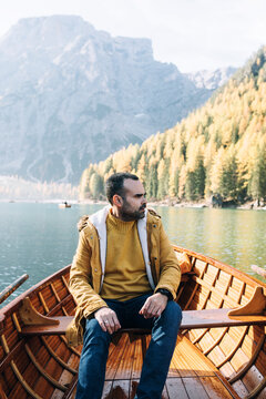 Young men In A Wooden Boat In Lake Braies