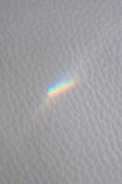 light rainbow spectrum on a grey background