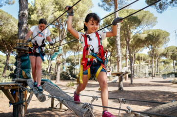 Little girls in an adventure park