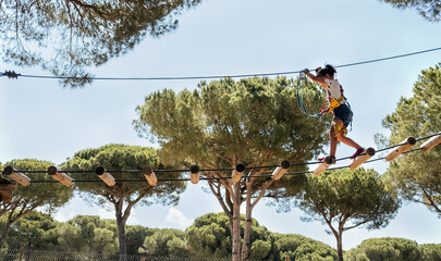 Little girl in an adventure park