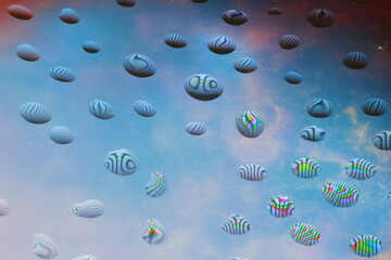 intricate patterns of water droplets on the display glass