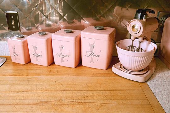 Kitchen mixer and canisters on a counter top in a kitchen