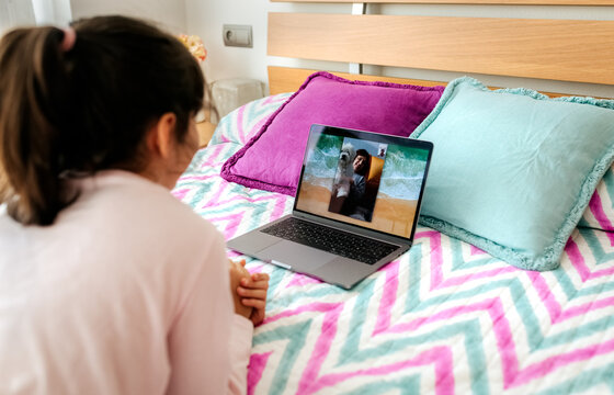 Two little sisters making video conference